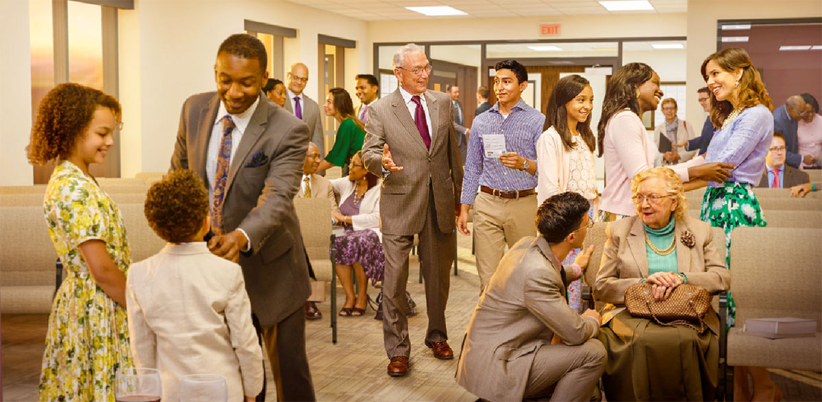 Broers en susters gesels lekker voor ’n gemeentelike vergadering.