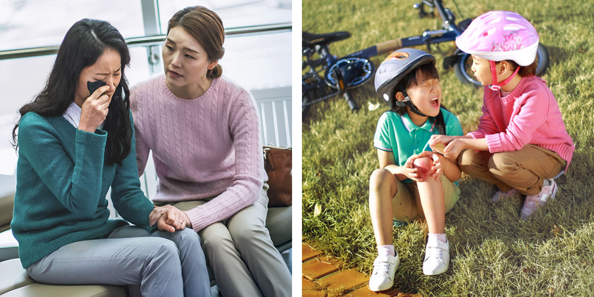 فتاة تواسي فتاة اخرى جلفت ركبتها؛‏ امرأة تواسي امرأة اخرى تبكي