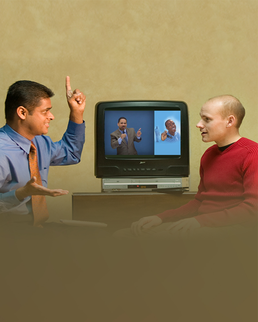 One of Jehovah’s Witnesses studies the Bible with a man