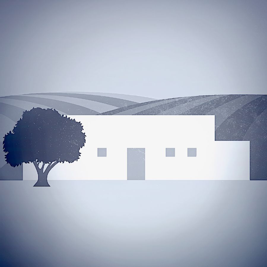 Una casa gran i un camp de blat