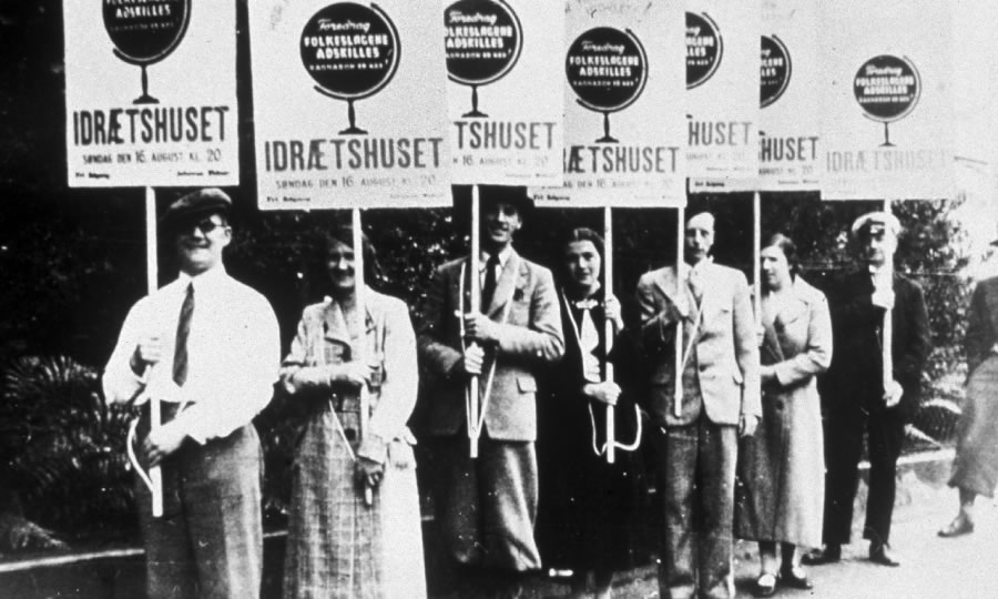 A line of Jehovah’s Witnesses carrying placards in Denmark in the 1930’s