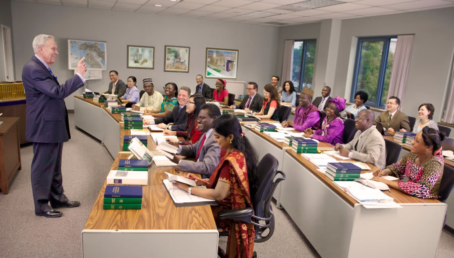A classroom of Gilead students listening to a Gilead instructor