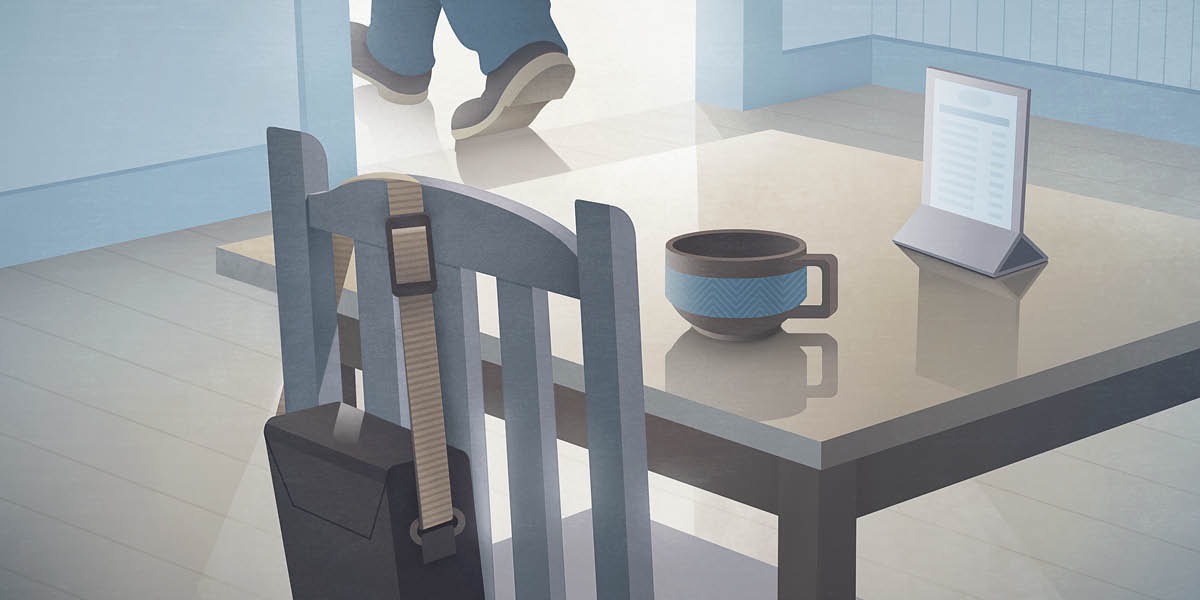 Un hombre sale de una cafetería y olvida su maletín en una silla.