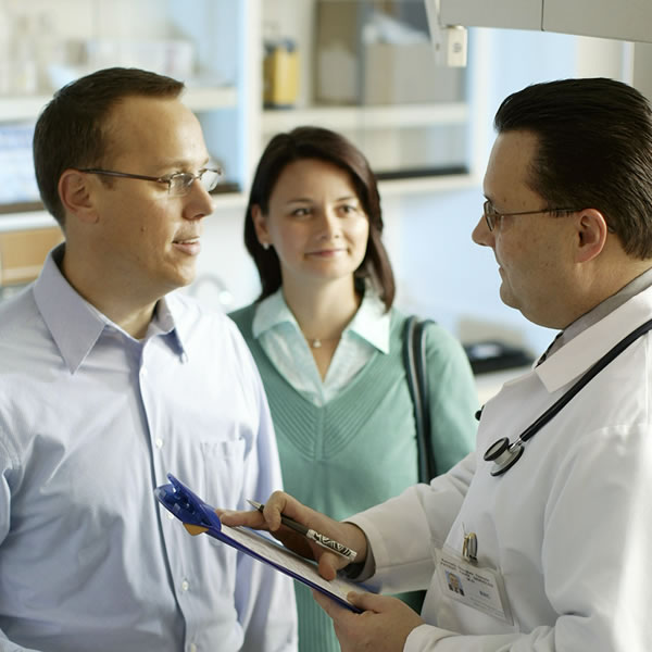 A couple talking to their doctor