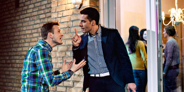 A man complains to his neighbor about noise coming from his late-night party