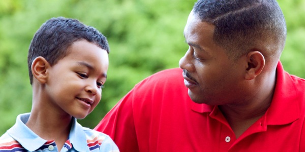 A father having a conversation with his young son