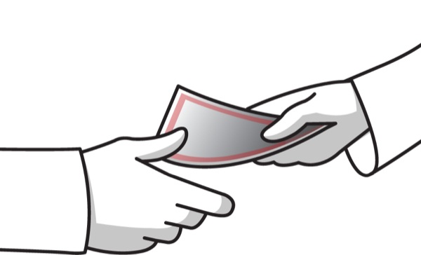 A person giving bribe money to another person
