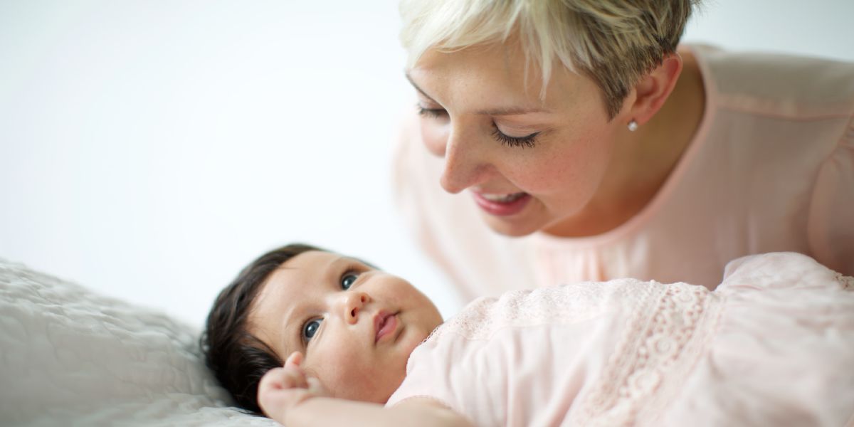 A mother talks to her baby