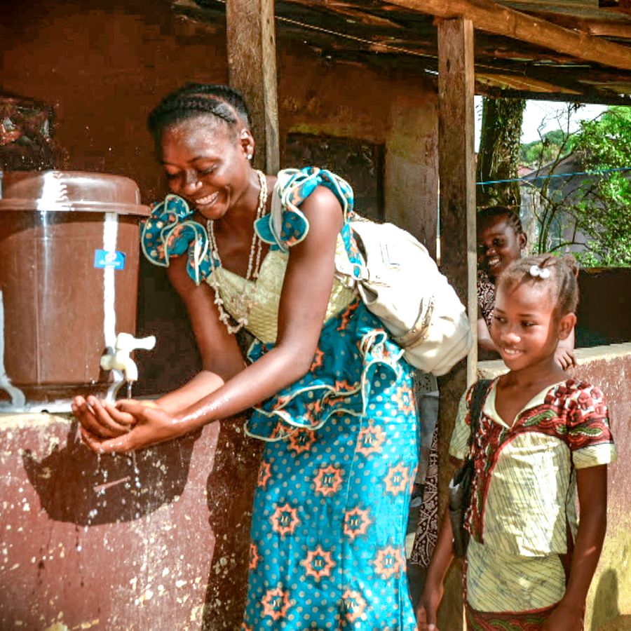 A woman washes her hands