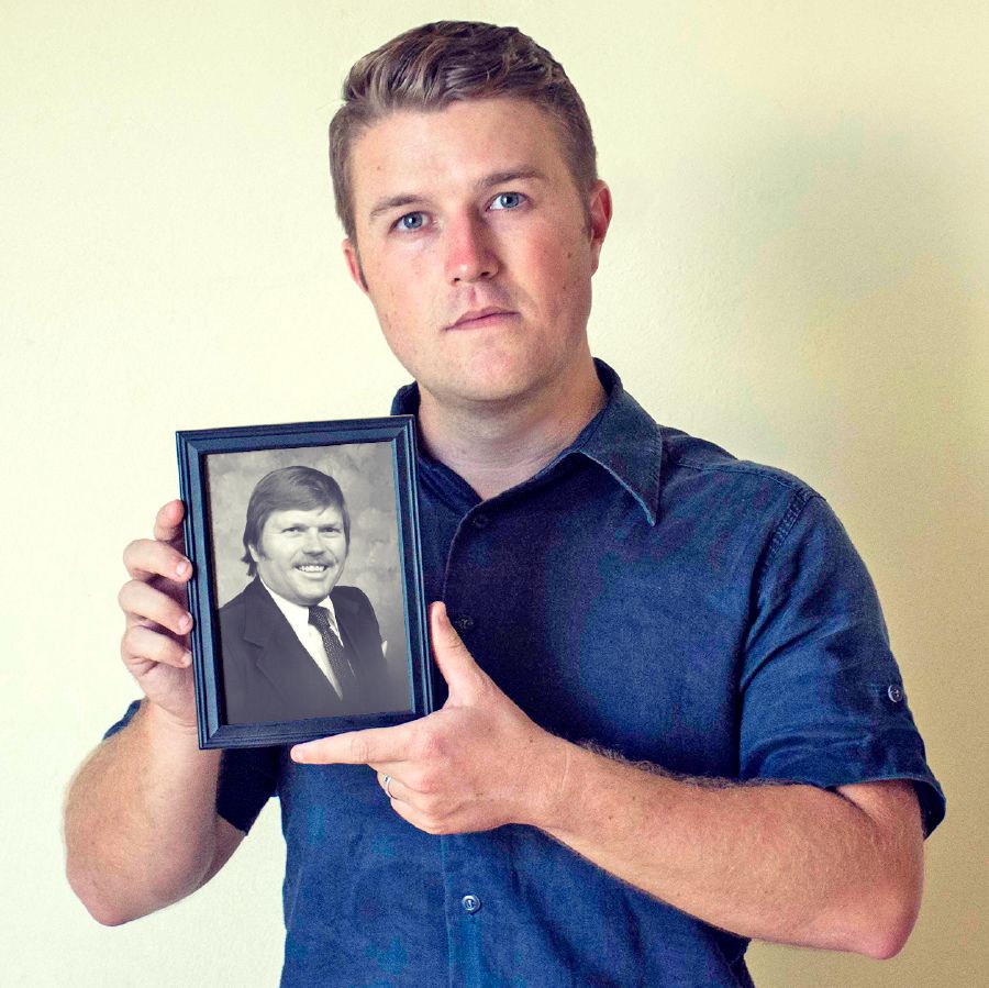 Derrick holds a picture of his father