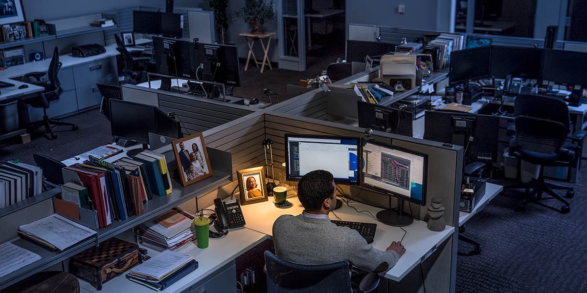 A man works late at night at his job