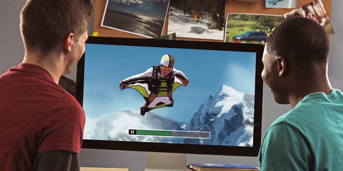 Two young men watch a thrill-seeking sport on the Internet