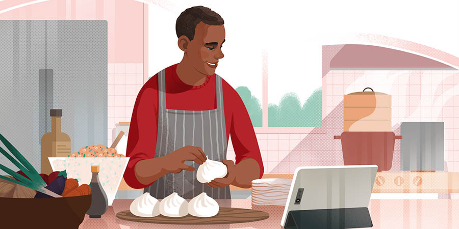 A man watching a video tutorial while cooking.