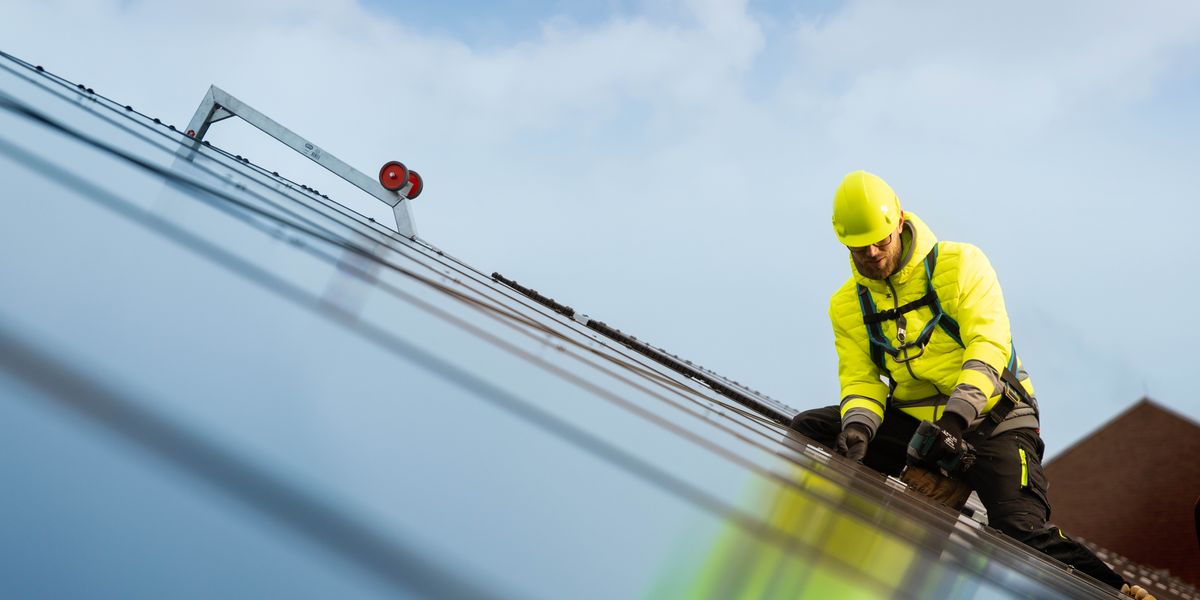 A brother installing photovoltaic system panels.