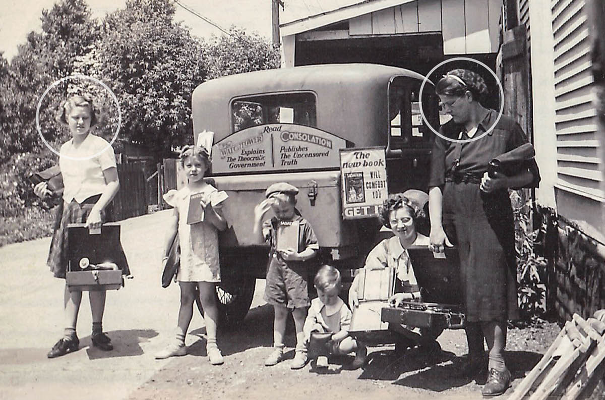 Young Camilla witnessing with her mother and four of her siblings. Camilla and her mother hold portable phonographs.