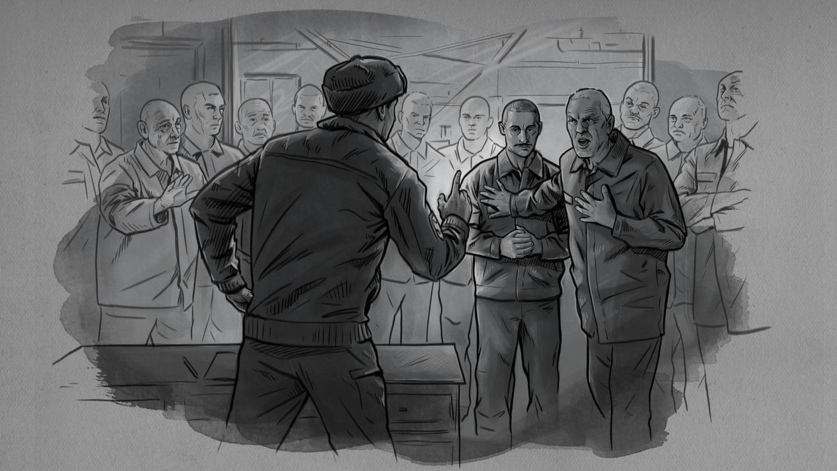 Virgilijus standing behind another prisoner who is arguing with a prison work manager. Other prisoners are gathered around them and observing the interaction.