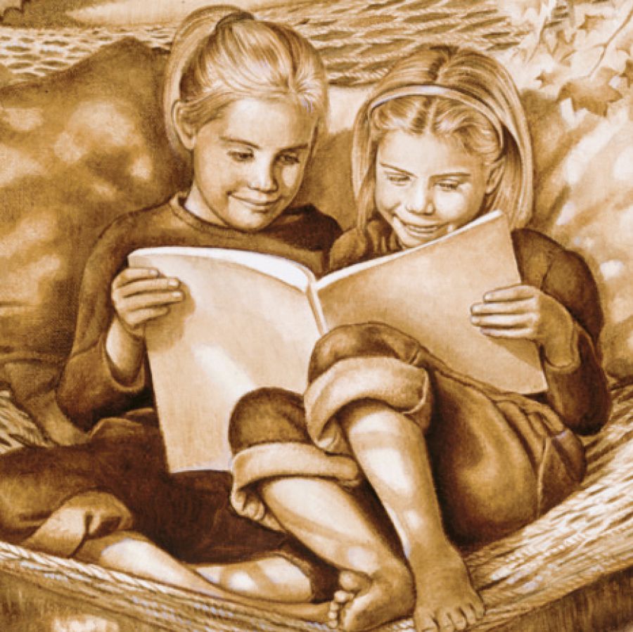 Two girls read a book together