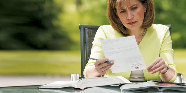 A Christian woman records her medical decisions on a health proxy form