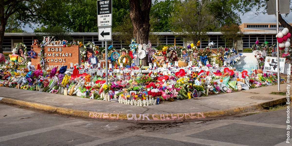 Flowers placed at the entrance of an elementary school where a mass shooting took place.