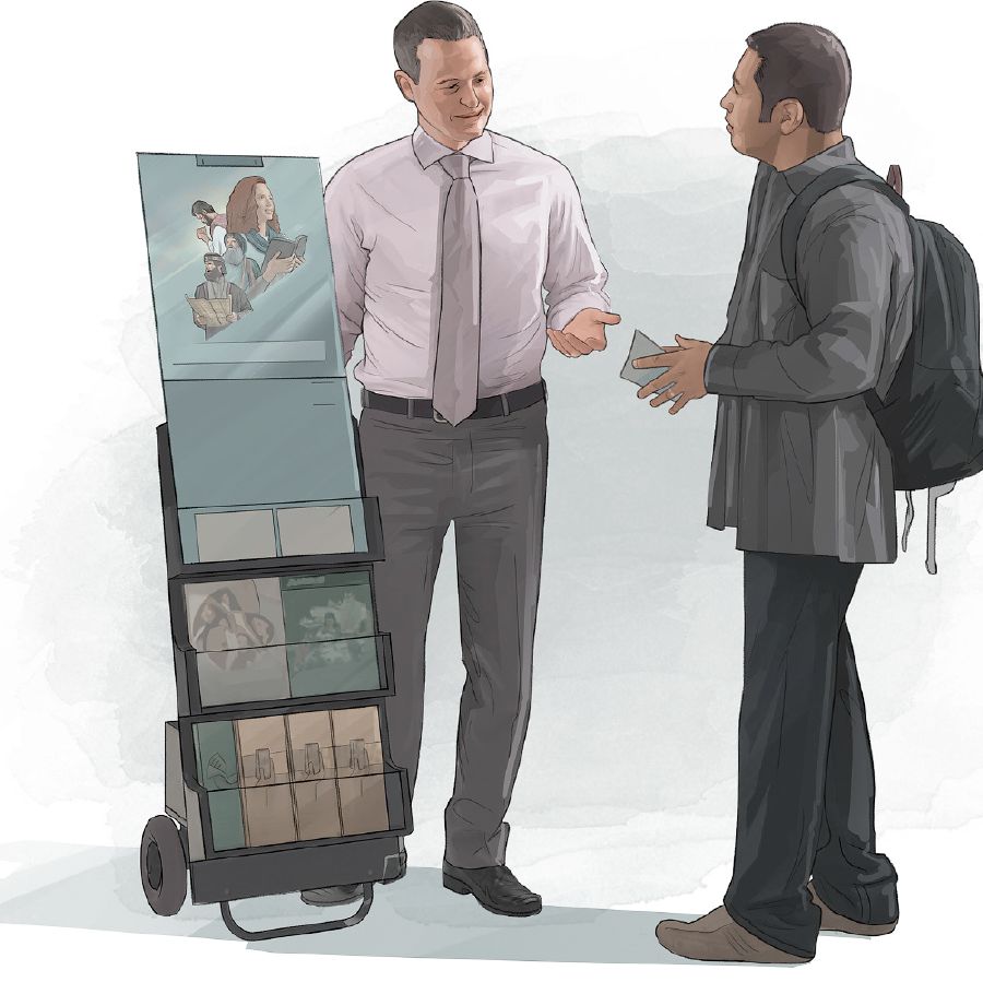 One of Jehovah’s Witnesses stands by a public witnessing cart and preaches to a man