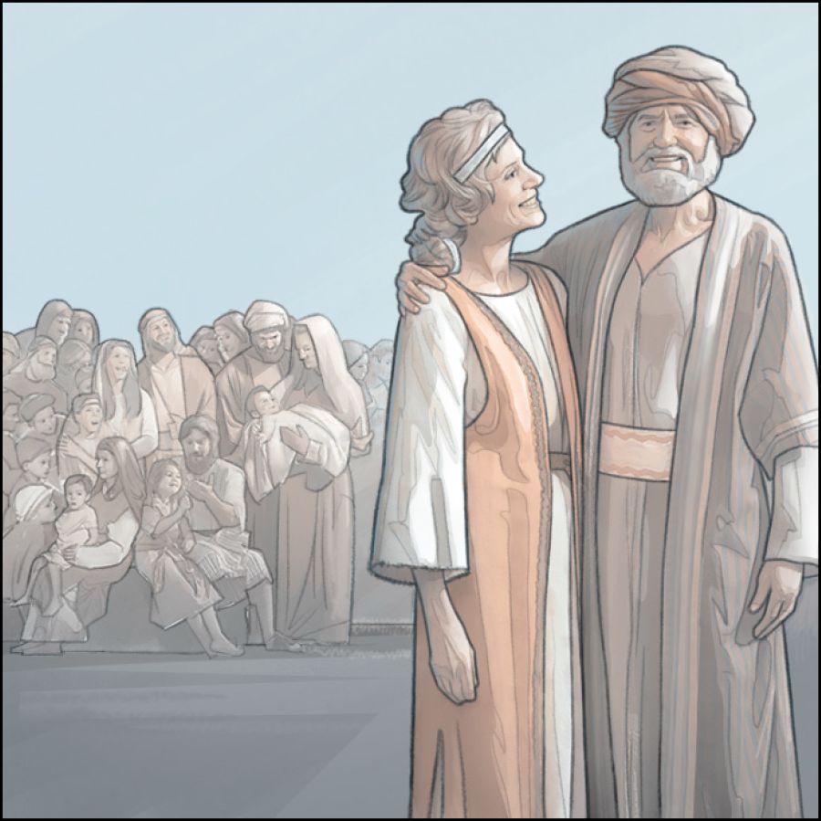 Job and his wife stand with their extended family