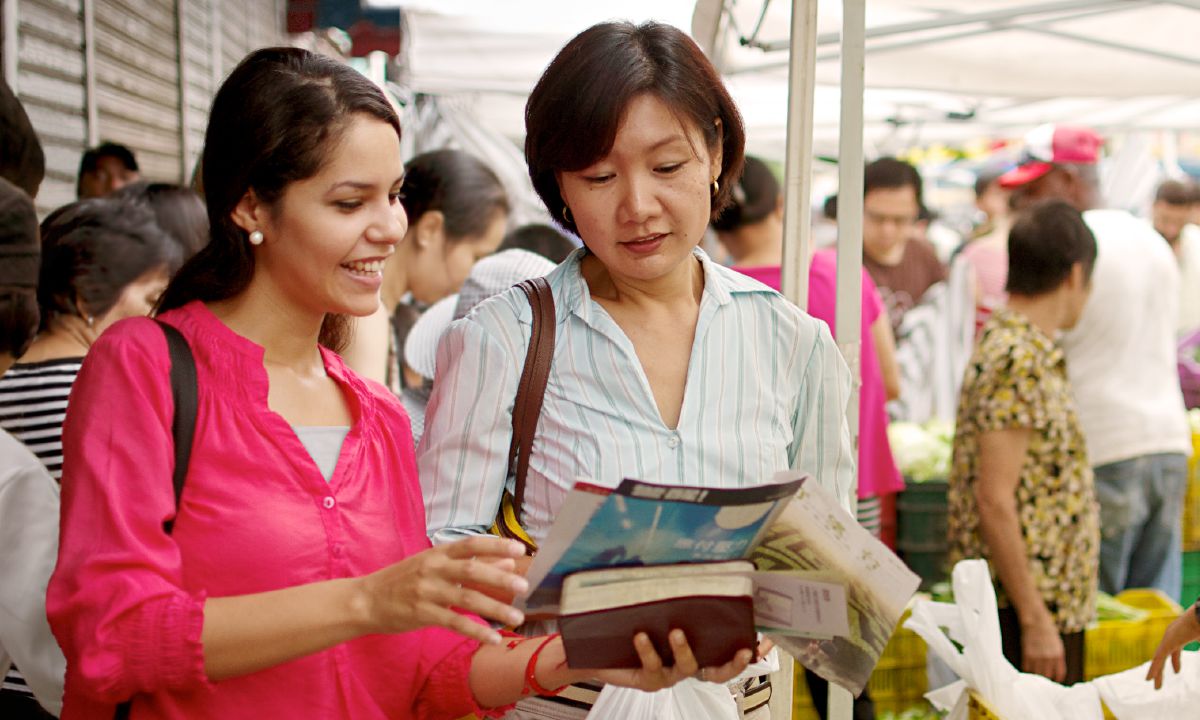 A young sister preaches in a foreign language