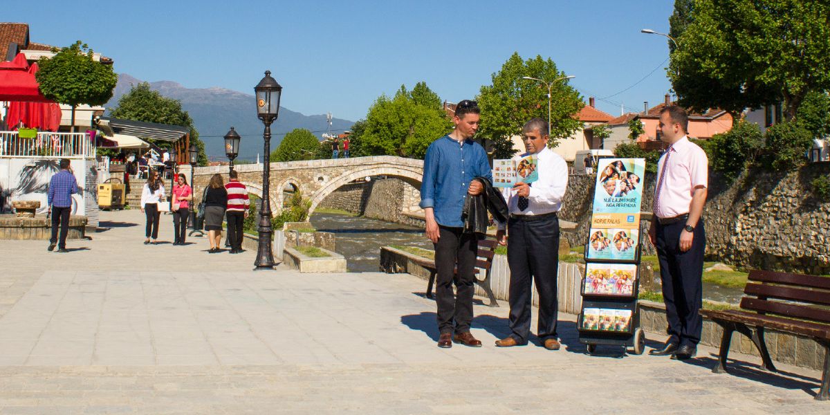 Two brothers doing public witnessing at a cart