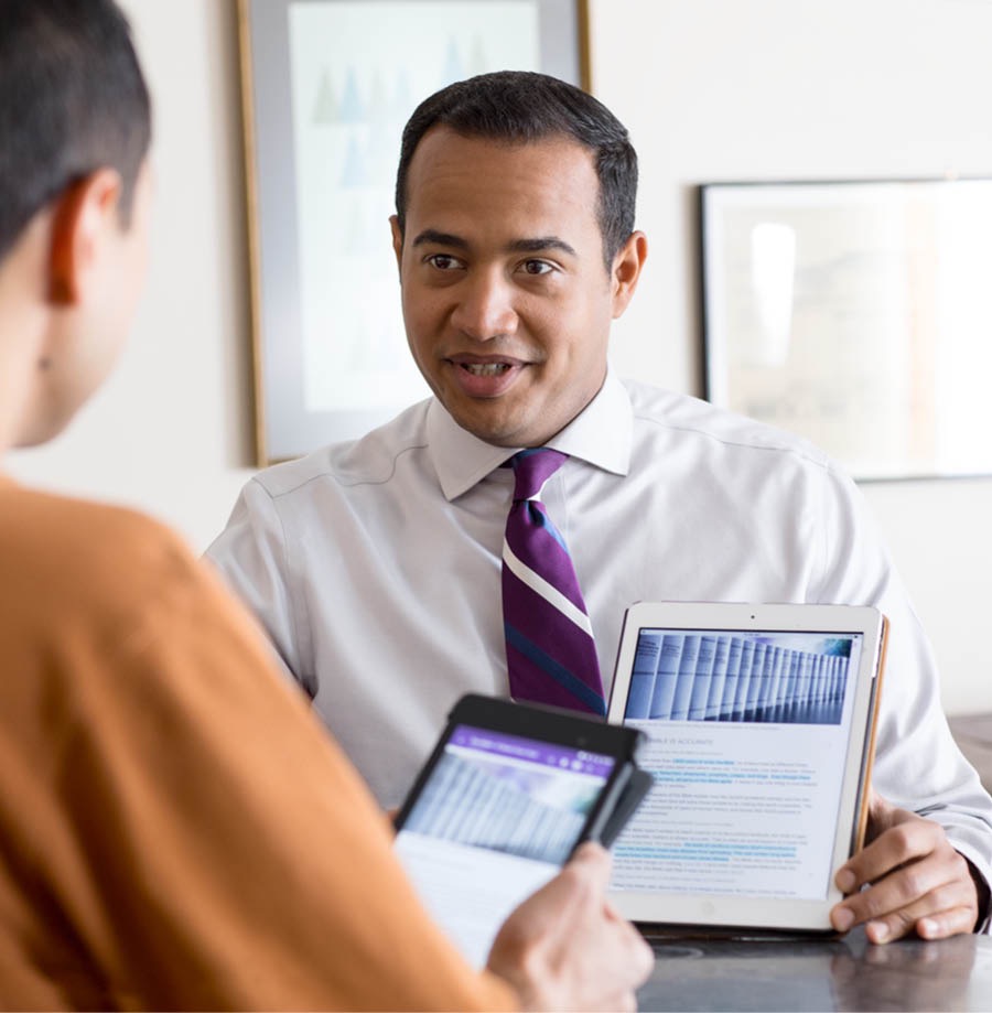 A brother shows his Bible student his studied publication