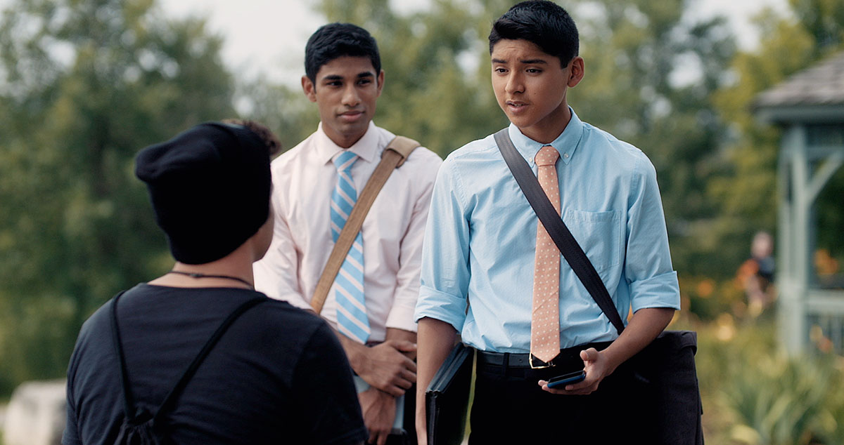 A pioneer brother works in field service with a younger brother in the congregation