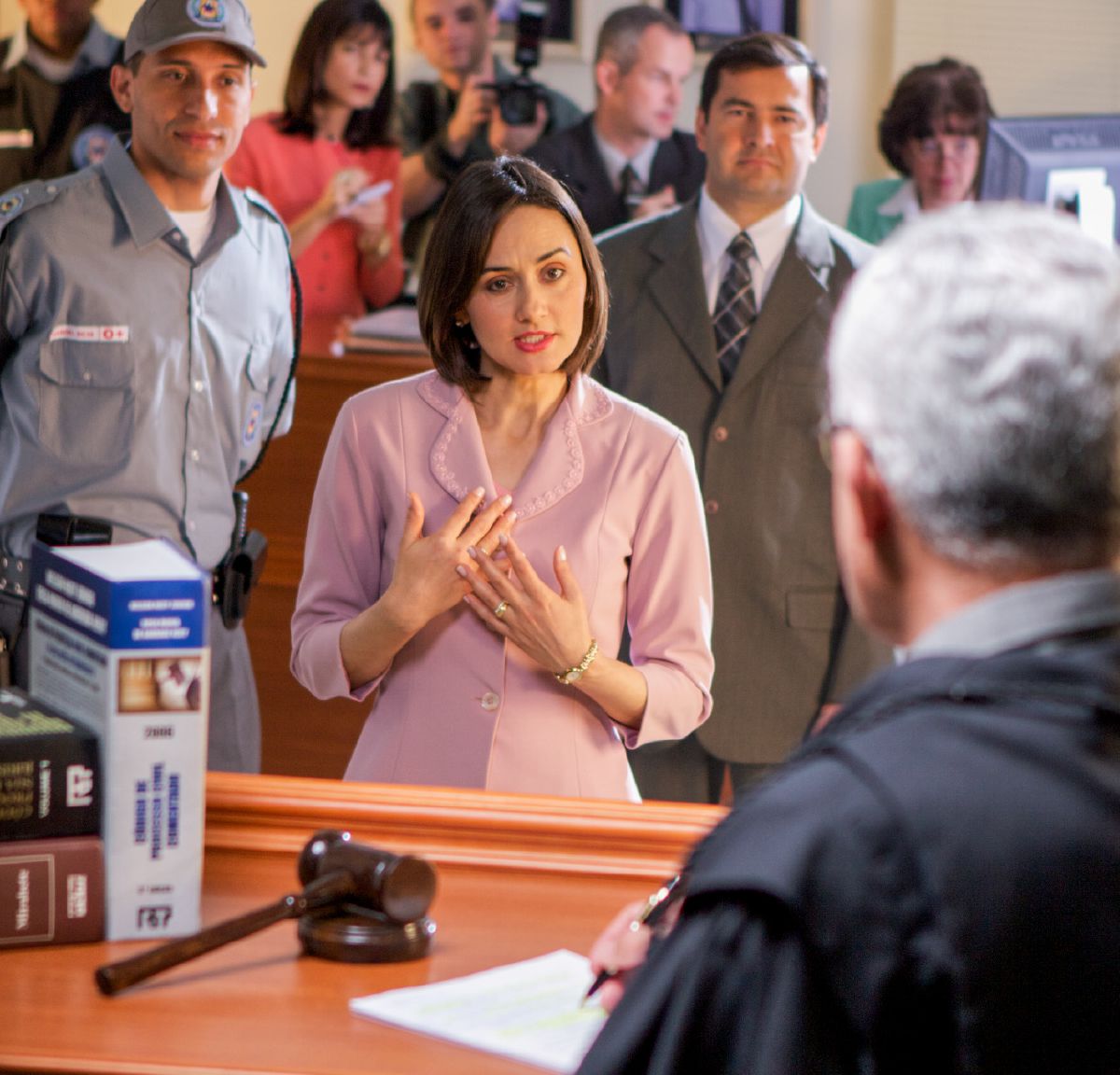 A sister stands before a judge and witnesses to him