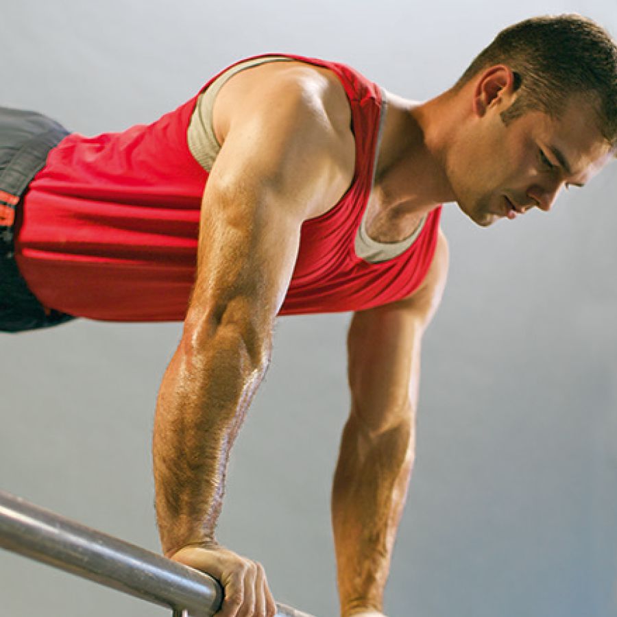 A man exercises to strengthen his muscles