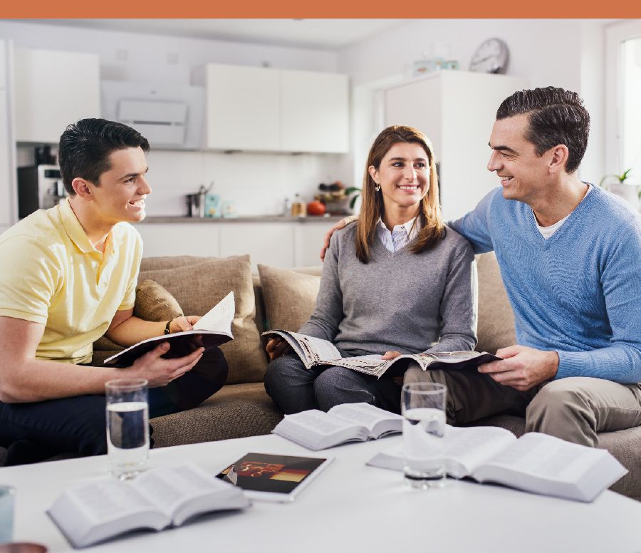 A family participating in family worship.