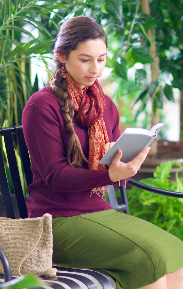 A young woman reading her Bible