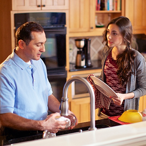 A father listens to his teenage daughter