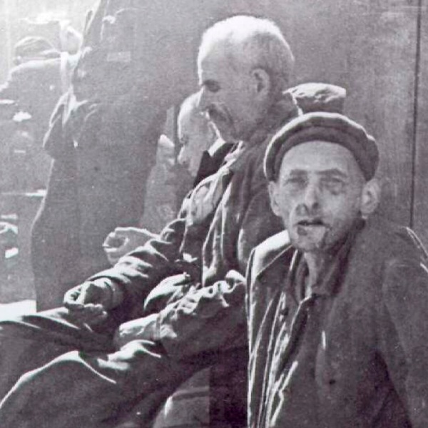 Starving men in a concentration camp