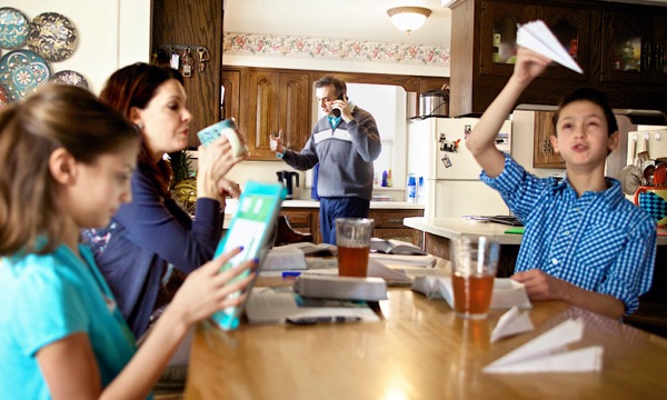 A chaotic Family Worship session—each family member is distracted by personal matters