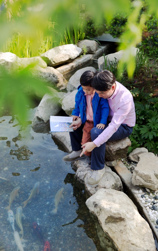 A parent teaching his child using lessons from creation