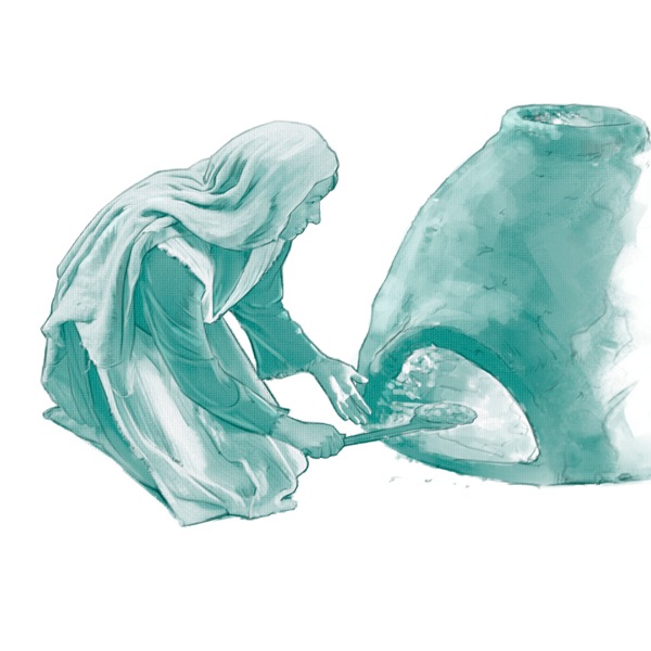 A woman takes baked bread out of a small oven