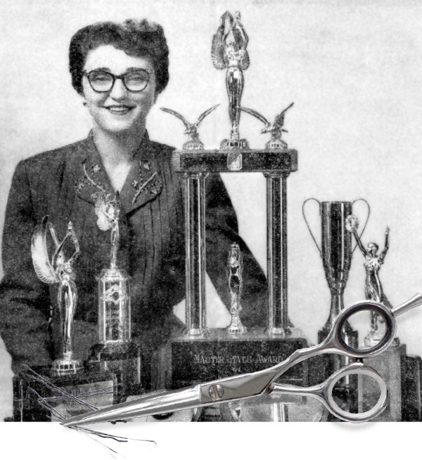 Melita Jaracz stands beside trophies she received for hairdressing