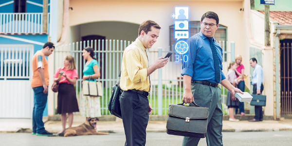 While in the door-to-door ministry, a Christian brother checks the status of a sports event on his cell phone