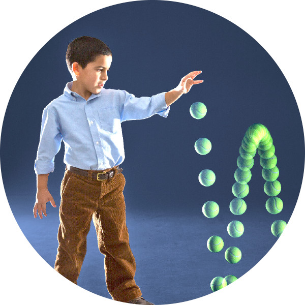 A boy dropping a ball