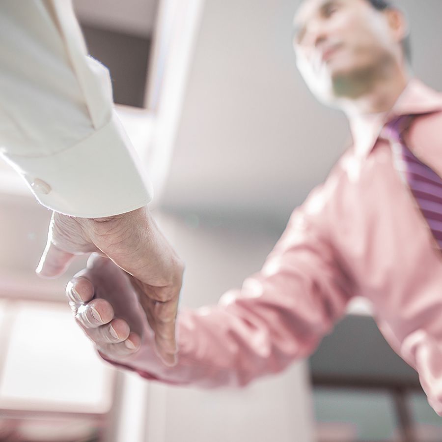 Two Christian brothers shake hands