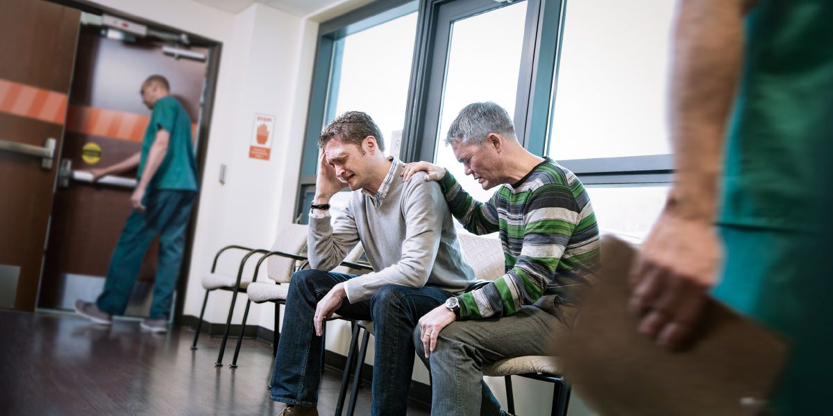 Distraught people in a hospital waiting room