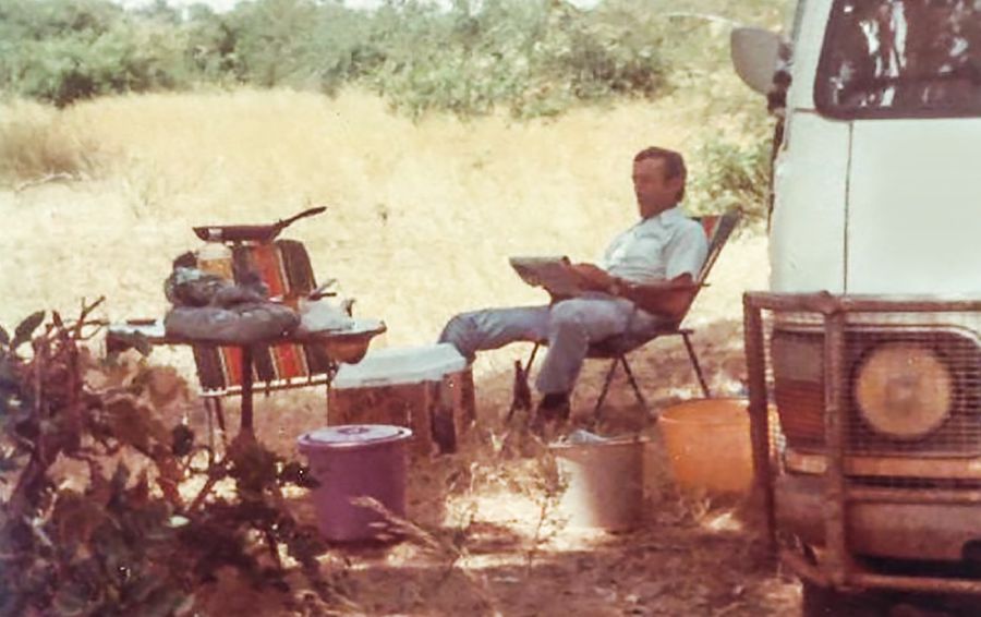 Maxim Danyleyko with the van used as their home while in traveling work