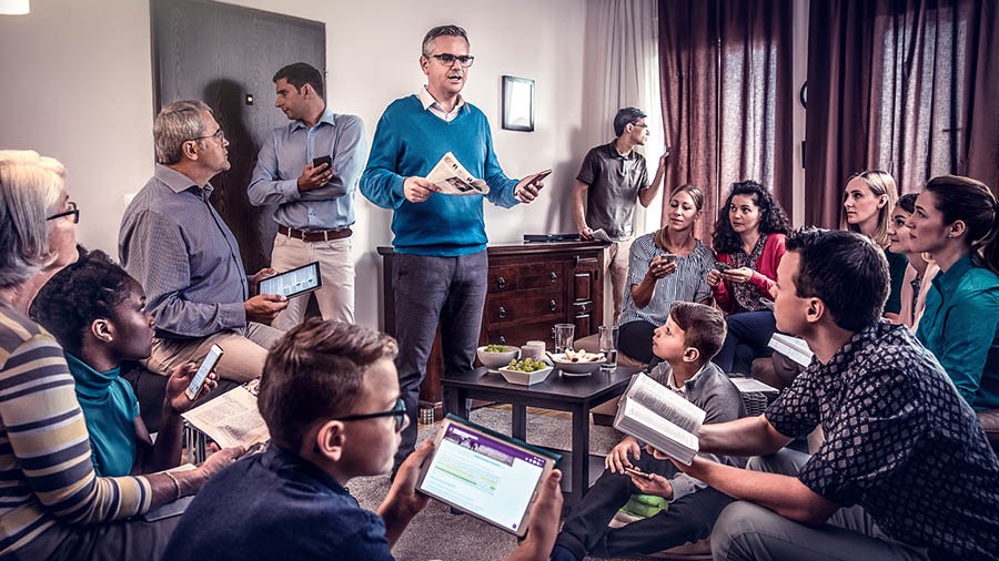 Witnesses in a country where our work is restricted attend a meeting in a private home