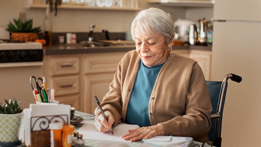 A sister in a wheelchair witnesses by writing letters