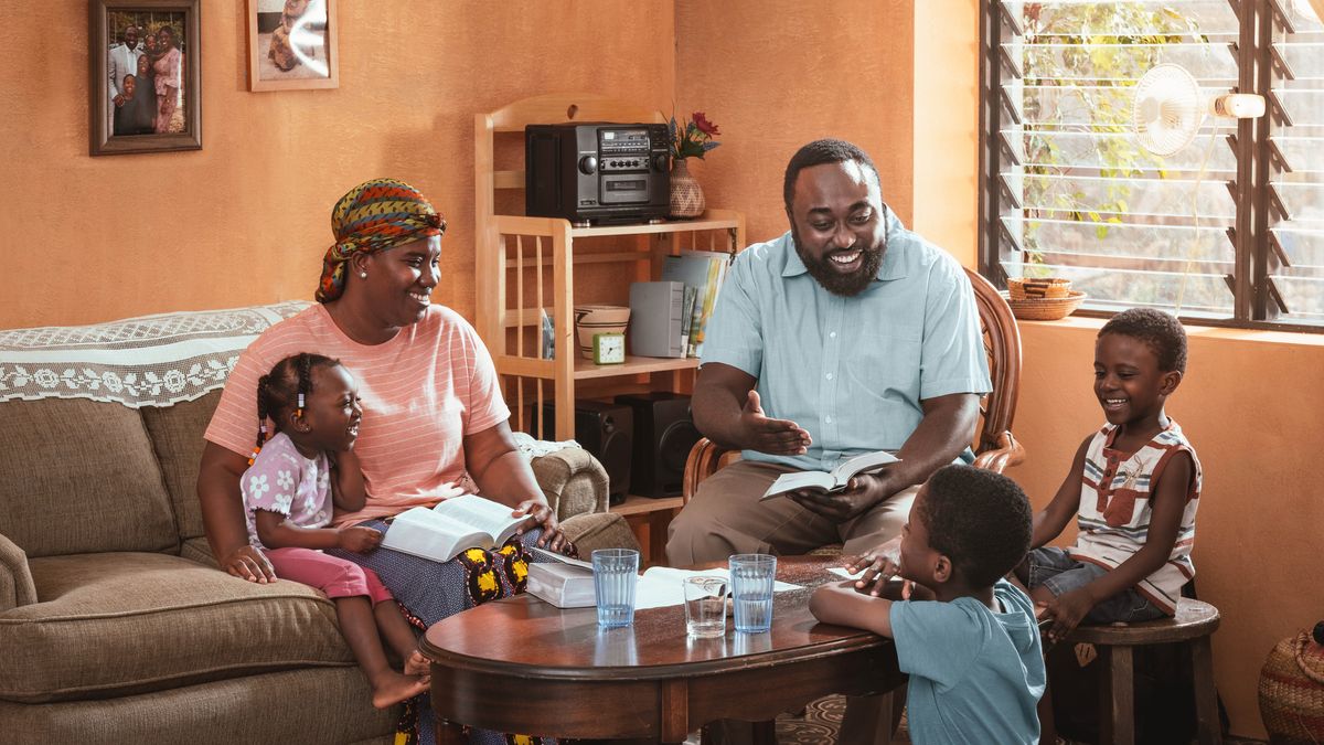 The brother from the opening image conducts family worship with his wife and young children.