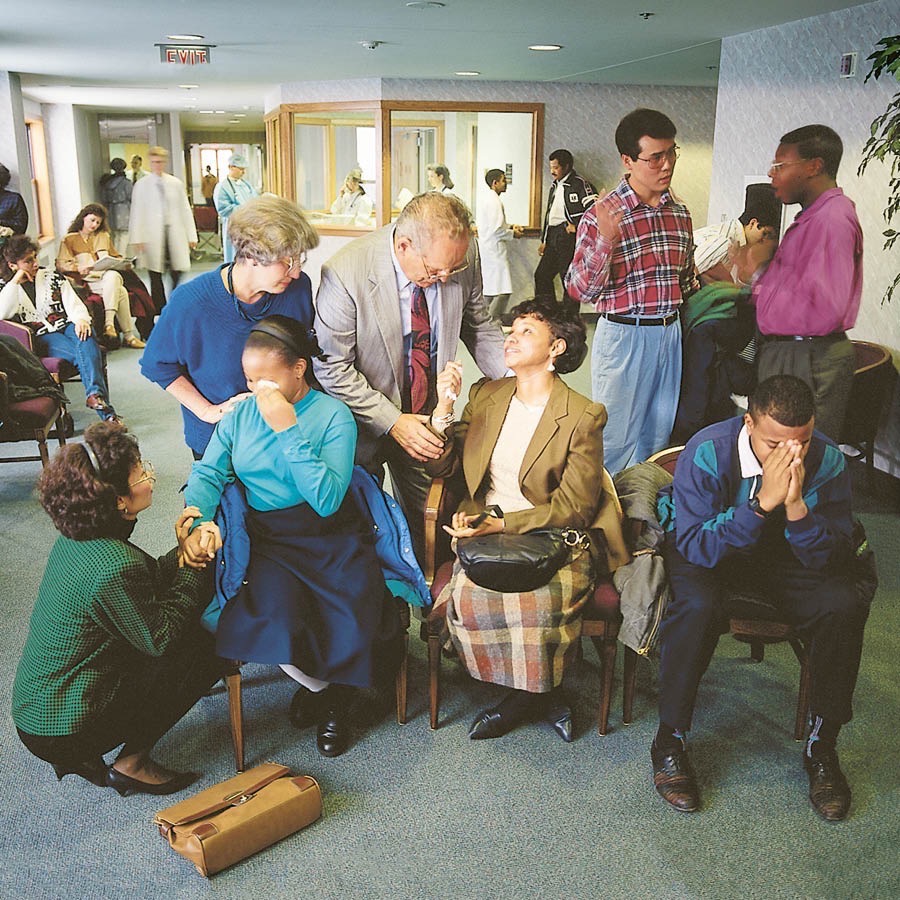 Friends encouraging the bereaved at a hospital