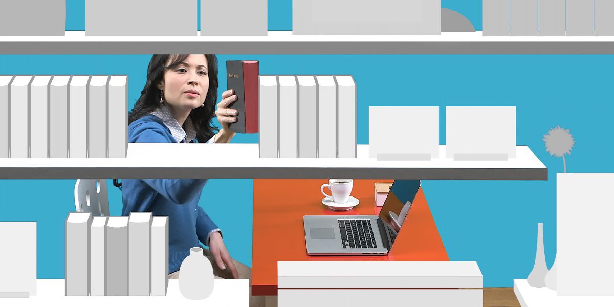 A woman takes the Bible from a bookshelf