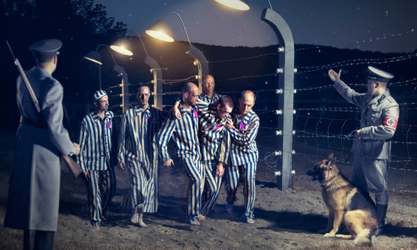 Christian brothers helping one another in a concentration camp